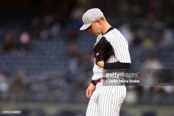 Michael King of the New York Yankees reacts after giving up a two-run home run to Brad Miller of the Texas Rangers in the seventh inning at Yankee...