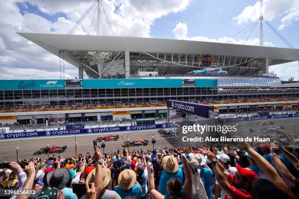 Fans enjoy the atmosphere at the start during the F1 Grand Prix of Miami at the Miami International Autodrome on May 08, 2022 in Miami, Florida.