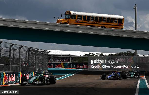 Lance Stroll of Canada driving the Aston Martin AMR22 Mercedes leads Nicholas Latifi of Canada driving the Williams FW44 Mercedes and Sebastian...