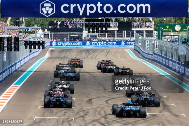 The field heads towards the first corner during the F1 Grand Prix of Miami at the Miami International Autodrome on May 08, 2022 in Miami, Florida.