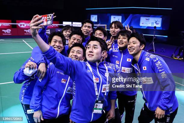 Team Japan poses for a group selfie photo before the Thomas cup round robin match against Team United States during day two of the BWF Thomas and...
