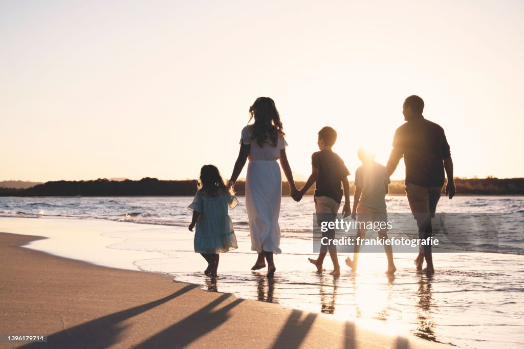 Beautiful family together at sunset