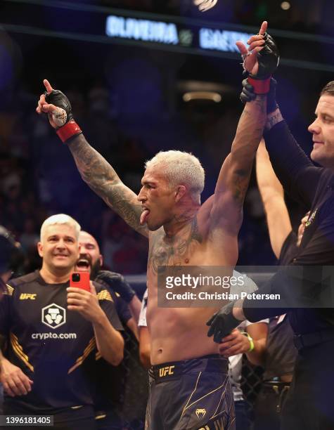Charles Oliveira of Brazil celebrates after his submission victory over Justin Gaethje in their UFC lightweight championship bout during UFC 274 at...