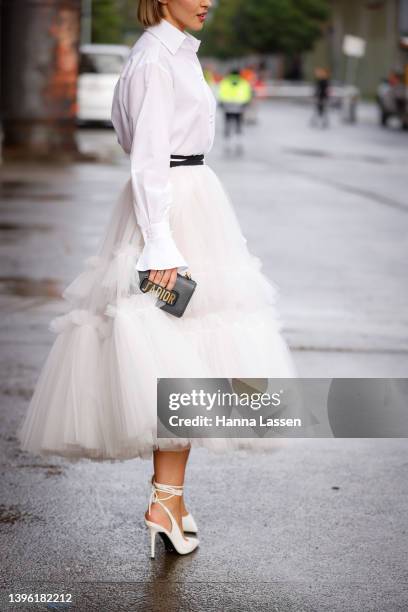 Olivia Molly Rogers is seen wearing Dior white shirt, tulle skirt and bag during Afterpay Australian Fashion Week 2022 on May 09, 2022 in Sydney,...