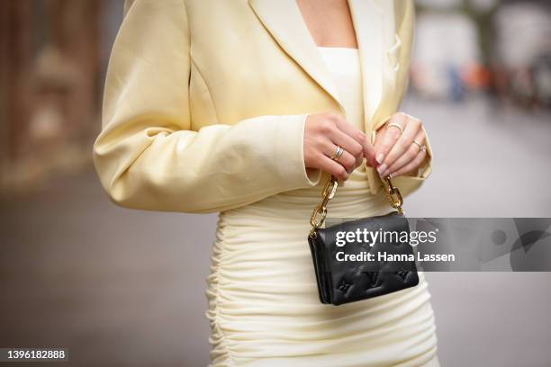 Holly Titheridge is seen wearing Maggie Marilyn dress, Awake shoes and Louis vuitton bag at Afterpay Australian Fashion Week 2022 on May 09, 2022 in...