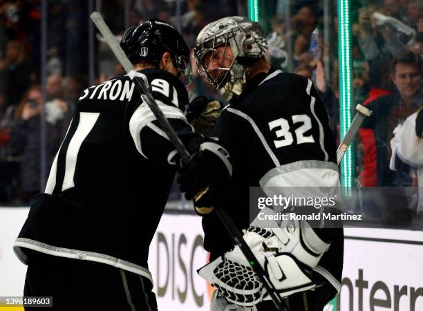 Carl Grundstrom and Jonathan Quick of the Los Angeles Kings celebrate a 4-0 win against the Edmonton Oilers after Game Four of the First Round of the...