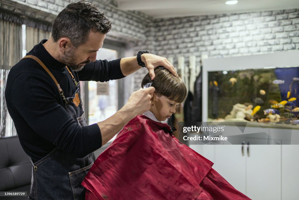 Cute Boy Getting Haircut At Hair Salon High-Res Stock Photo - Getty Images