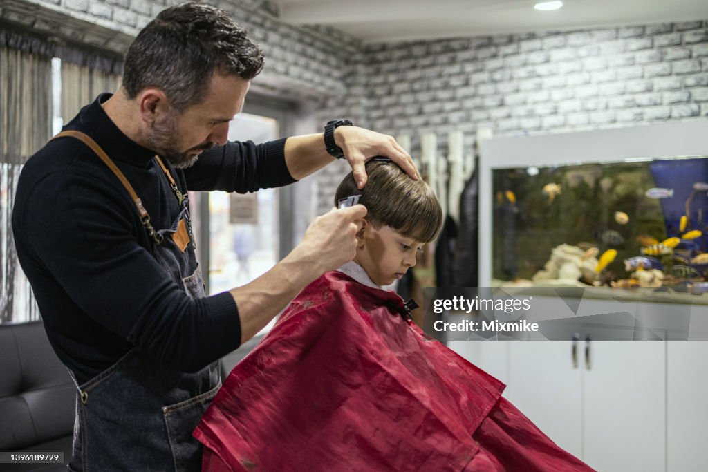 Cute Boy Getting Haircut At Hair Salon High-Res Stock Photo - Getty Images Cute Boy Getting Haircut At Hair Salon High-Res Stock Photo - Getty Images