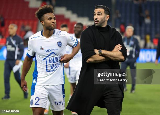 Adil Rami of Troyes talks to Erik Palmer-Brown of Troyes following the Ligue 1 Uber Eats match between Paris Saint-Germain and ESTAC Troyes at Parc...