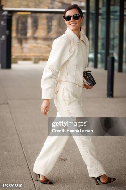 Jess Pecoraro is seen wearing Tory Burch denim suit and Dior bag at Afterpay Australian Fashion Week 2022 on May 09, 2022 in Sydney, Australia.