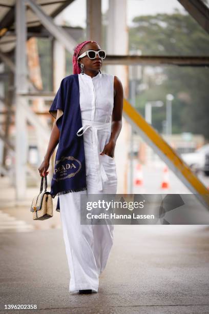 Suzan Mutesi is seen wearing rada scarf, Bondi Born outft and gold Guess bag at Afterpay Australian Fashion Week 2022 on May 09, 2022 in Sydney,...