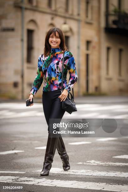 Sarah Ellen is seen wearing Romance Was Born top, Longchamp bag and black knee hight boots at Afterpay Australian Fashion Week 2022 on May 09, 2022...