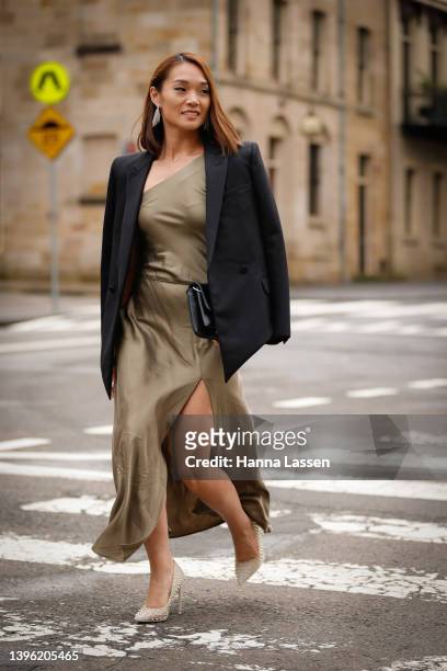 Cai is seen wearing Bec and Bridge dress maxi in Moondance green, YSL jacket, Stiletto studded white heel Steve Madden, Gucci clutch black, Isabel...