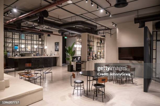 informal meeting area in coworking office - exposed ceiling stock pictures, royalty-free photos & images