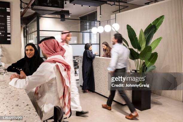 middle eastern professionals in riyadh coworking office - middle east stock pictures, royalty-free photos & images