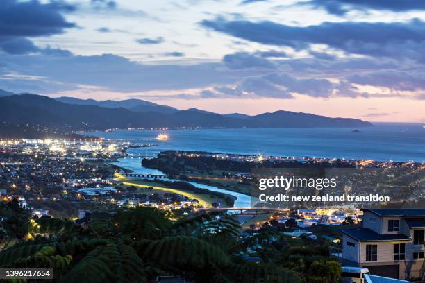 view of hutt river and wellington harbour at blue hour, looking south from hutt valley, wellington, nz - timelapse new zealand stock pictures, royalty-free photos & images