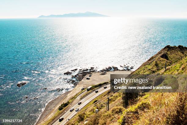 view of kapiti island and sh59 from escarpment track on a fine day, kapiti coast, nz - kapiti coast stock pictures, royalty-free photos & images