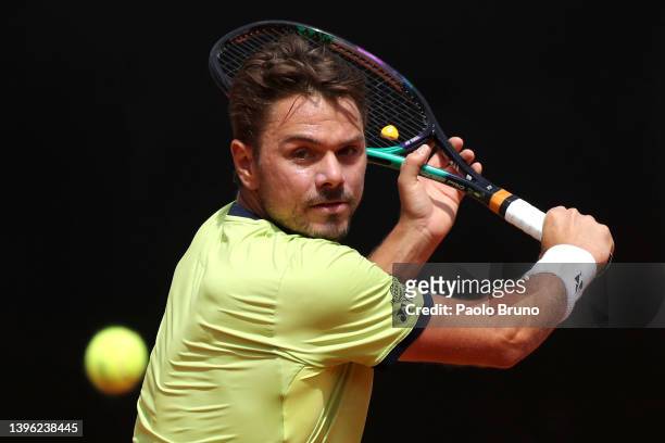Stan Wawrinka of Switzerland returns a backhand against Reilly Opelka of USA during their singles first round match in the Internazionali BNL...