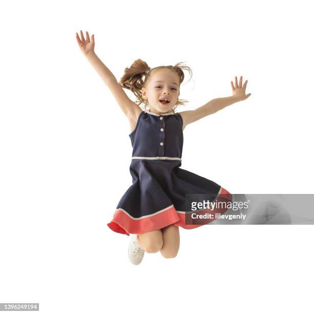 cheerful girl with long hair jumping on white background isolated. jump. energy and vivacity. happy child. childhood - mens long jump stockfoto's en -beelden