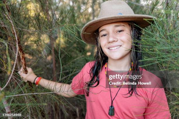 aboriginal australian family spends time together in a natural environment - aboriginal girl stock pictures, royalty-free photos & images