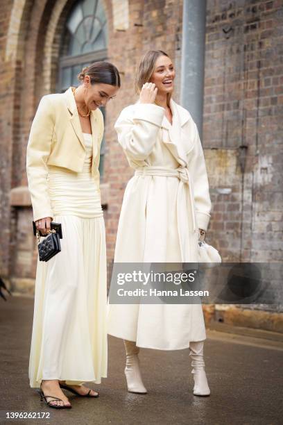 Holly Titheridge is seen wearing Maggie Marilyn dress, Awake shoes and Louis vuitton bag and Brooke Hogan wearing ivory jacket and boots at Afterpay...