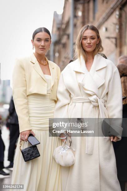 Holly Titheridge is seen wearing Maggie Marilyn dress, Awake shoes and Louis vuitton bag and Brooke Hogan wearing ivory jacket and boots at Afterpay...