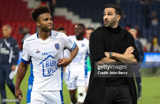 Adil Rami of Troyes talks to Erik Palmer-Brown of Troyes following the Ligue 1 Uber Eats match between Paris Saint-Germain and ESTAC Troyes at Parc...