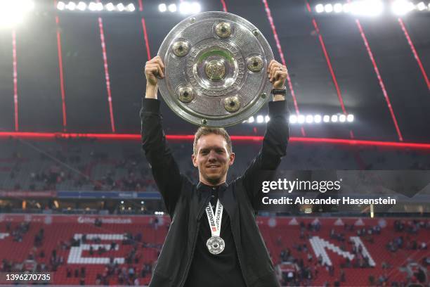 Julian Nagelsmann, Head Coach of FC Bayern Muenchen lifts The Bundesliga Meisterschale trophy following their sides finish as Bundesliga champions...