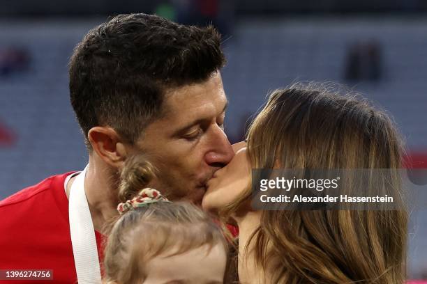Robert Lewandowski of FC Bayern Muenchen kisses his wife Anna Lewandowska in celebration as the Bundesliga champions after the Bundesliga match...
