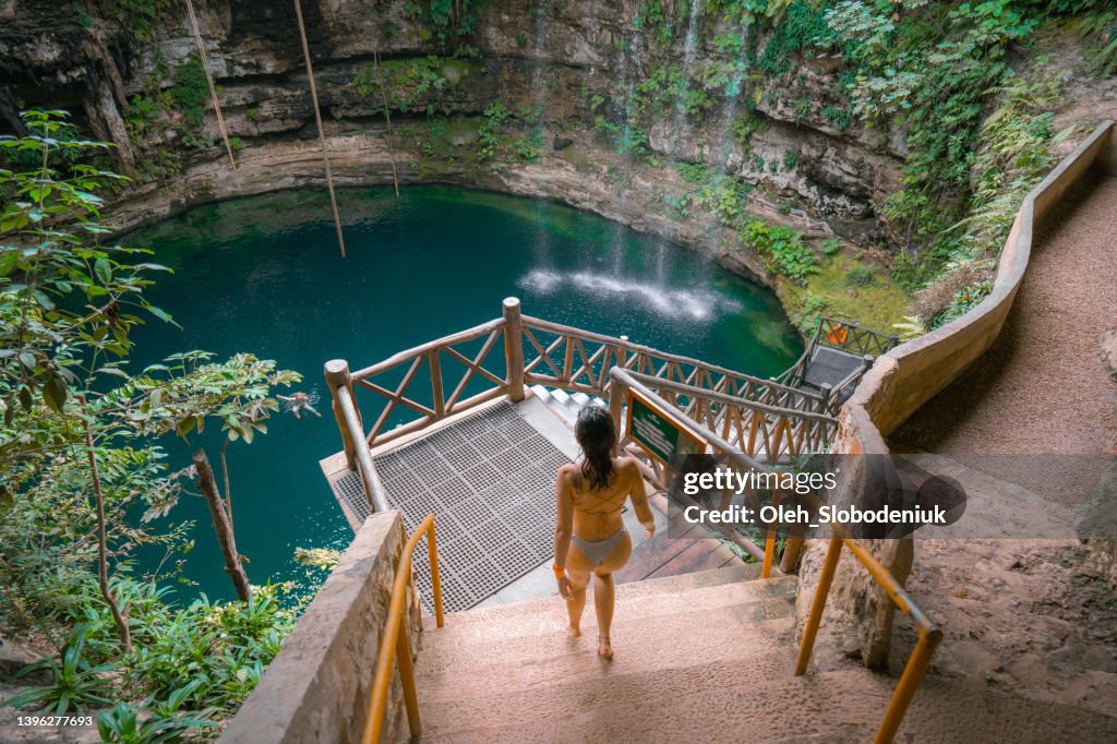 Woman in Cenote in Yucatan, Mexico