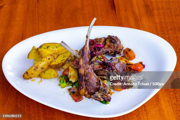 high angle view of food in plate on table,nairobi,kenya - lamb chop stock pictures, royalty-free photos & images