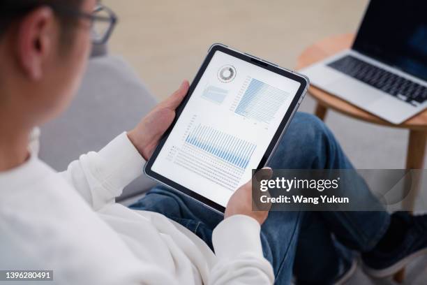 Checker Using Tablet Reading Tablet Over Shoulder Photos and Premium High Res Pictures ...