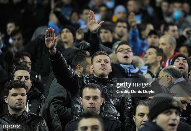 Lazio supporters cheer on their team during the UEFA Europa League Round of 32 second leg match between Atletico de Madrid and S.S. Lazio at Vincente...