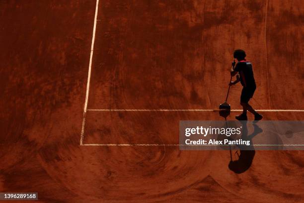 Ground staff prepare the clay court during the Internazionali BNL D'Italia at Foro Italico on May 09, 2022 in Rome, Italy.