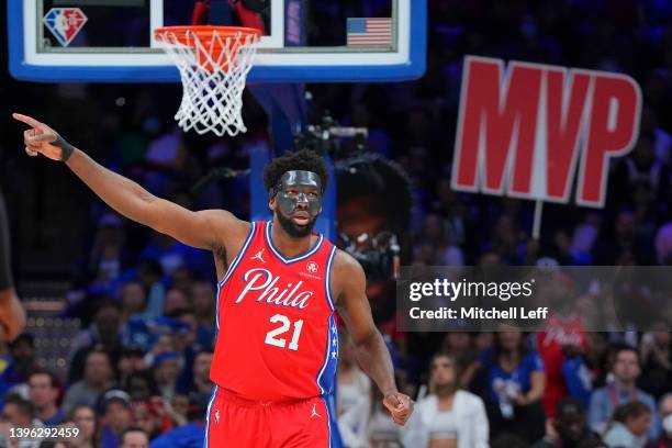 Joel Embiid of the Philadelphia 76ers points against the Miami Heat during Game Four of the 2022 NBA Playoffs Eastern Conference Semifinals at the...