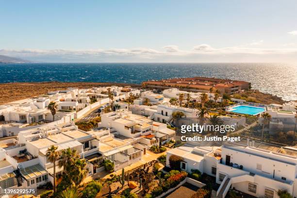 drone view of a residential district on the island of tenerife - tenerife stock-fotos und bilder