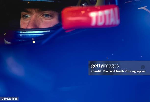 Nick Heidfeld from Germany looks out from the cockpit of the Gauloises Prost Peugeot Prost AP03 Peugeot V10 during practice for the Formula One...