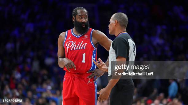 James Harden of the Philadelphia 76ers talks to referee Eric Lewis against the Miami Heat during Game Four of the 2022 NBA Playoffs Eastern...