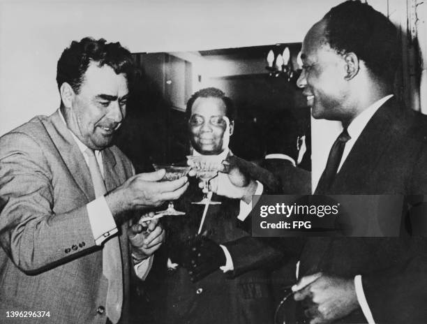 Ghanaian politician, political theorist, and revolutionary Kwame Nkrumah toasting with Soviet politician Leonid Brezhnev and Ghanaian diplomat and...