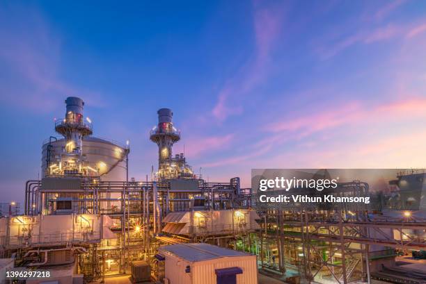 power plant and pipeline concept, natural gas combined cycle power plant and turbine generator with sky, steam turbine generator and stack tower. - carbon cycle stockfoto's en -beelden