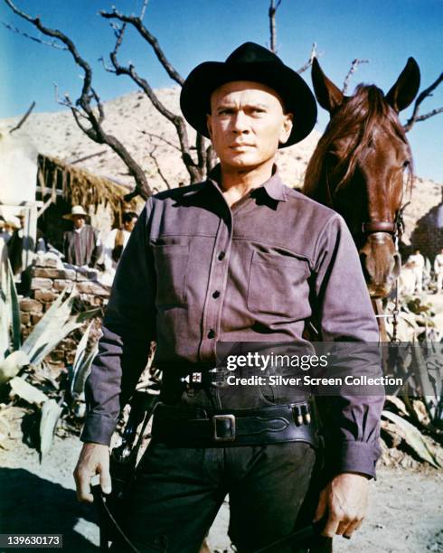 Yul Brynner , Russian-born US actor, in costume in a publicity still issued for the film, 'Return of the Seven', 1960. The musical, directed by Burt...