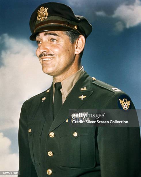 Clark Gable , US actor, dressed in US Air Force uniform, with a background of blue sky and clouds, circa 1945. Gable flew on combat missions as a...