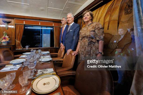 King Philippe of Belgium and Sophie Dutordoir CEO and Chair of the Executive Committee of the Belgian Railways inspects a 1912 first class royal...