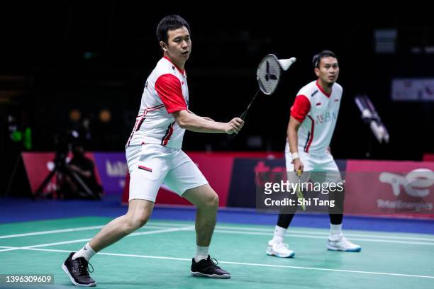 Mohammad Ahsan and Hendra Setiawan of Indonesia compete in the Men's Double match against Chaloempon Charoenkitamorn and Nanthakarn Yordphaisong of...