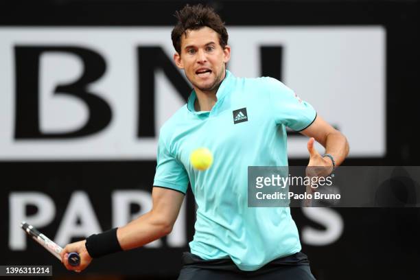 Dominic Thiem of Austria returns a forehand against Fabio Fognini of Italy during their singles first round match in the Internazionali BNL D'Italia...