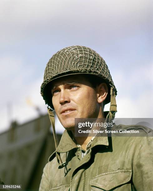 Jeffrey Hunter , US actor, in military fatigues and helmet in a publicity portrait issued for the film, 'The Longest Day', 1962. The war film,...