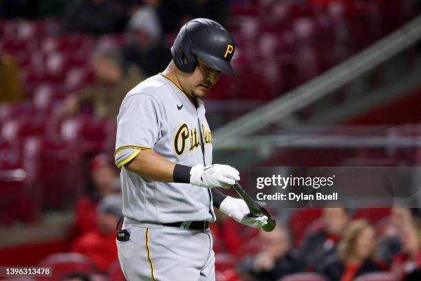 Yoshi Tsutsugo of the Pittsburgh Pirates walks back to the dugout after striking out in the seventh inning against the Cincinnati Reds during game...