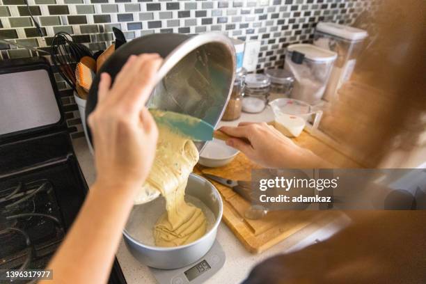 young woman baking a wedding cake - wedding cake stock pictures, royalty-free photos & images