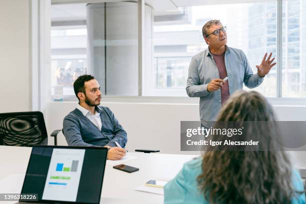 business man presenting strategies - tech headquarters stock pictures, royalty-free photos & images