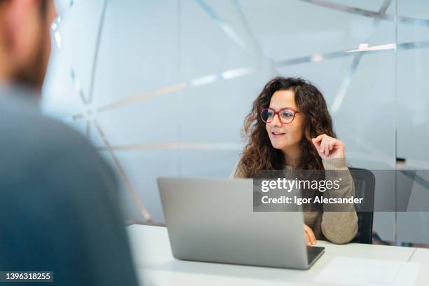 woman presenting ideas at meeting - compliance stock pictures, royalty-free photos & images